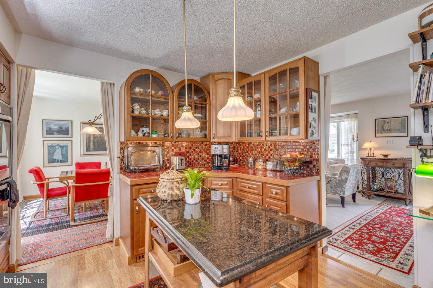209 Harvest Road Cherry Hill, NJ 08002 - Photo 17 of 46 an open kitchen with stainless steel appliances granite countertop a dining table and chairs