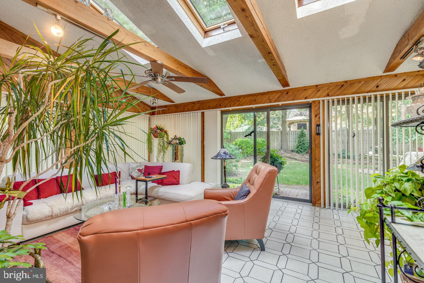 209 Harvest Road Cherry Hill, NJ 08002 - Photo 19 of 46 a living room with furniture and a floor to ceiling window