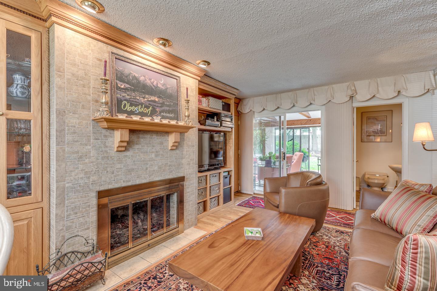 209 Harvest Road Cherry Hill, NJ 08002 - Photo 24 of 46 a living room with furniture windows and a fireplace