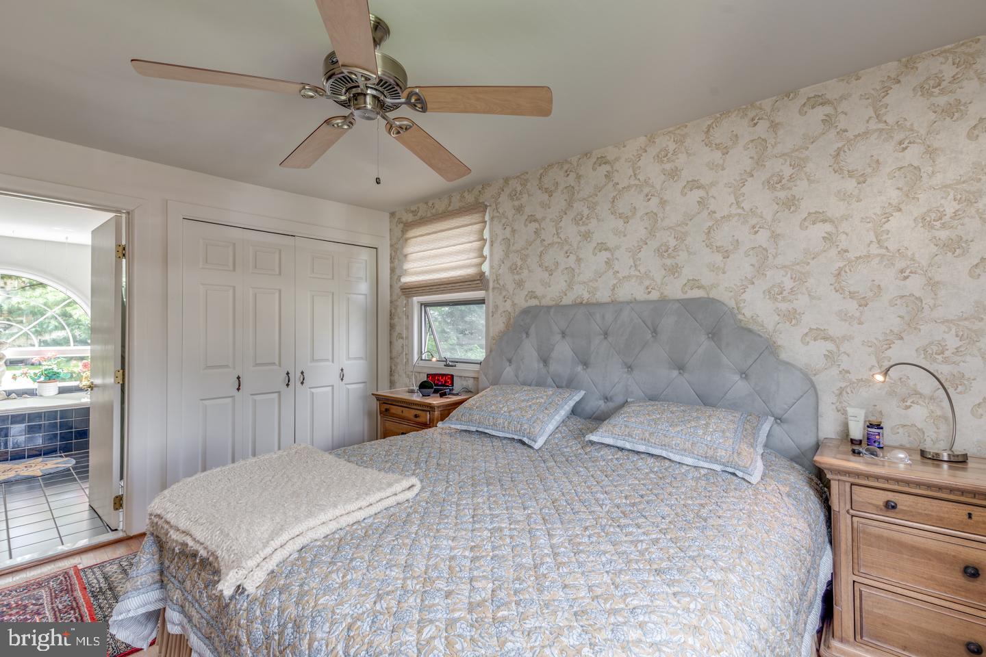 209 Harvest Road Cherry Hill, NJ 08002 - Photo 26 of 46 a bedroom with a bed and a chandelier