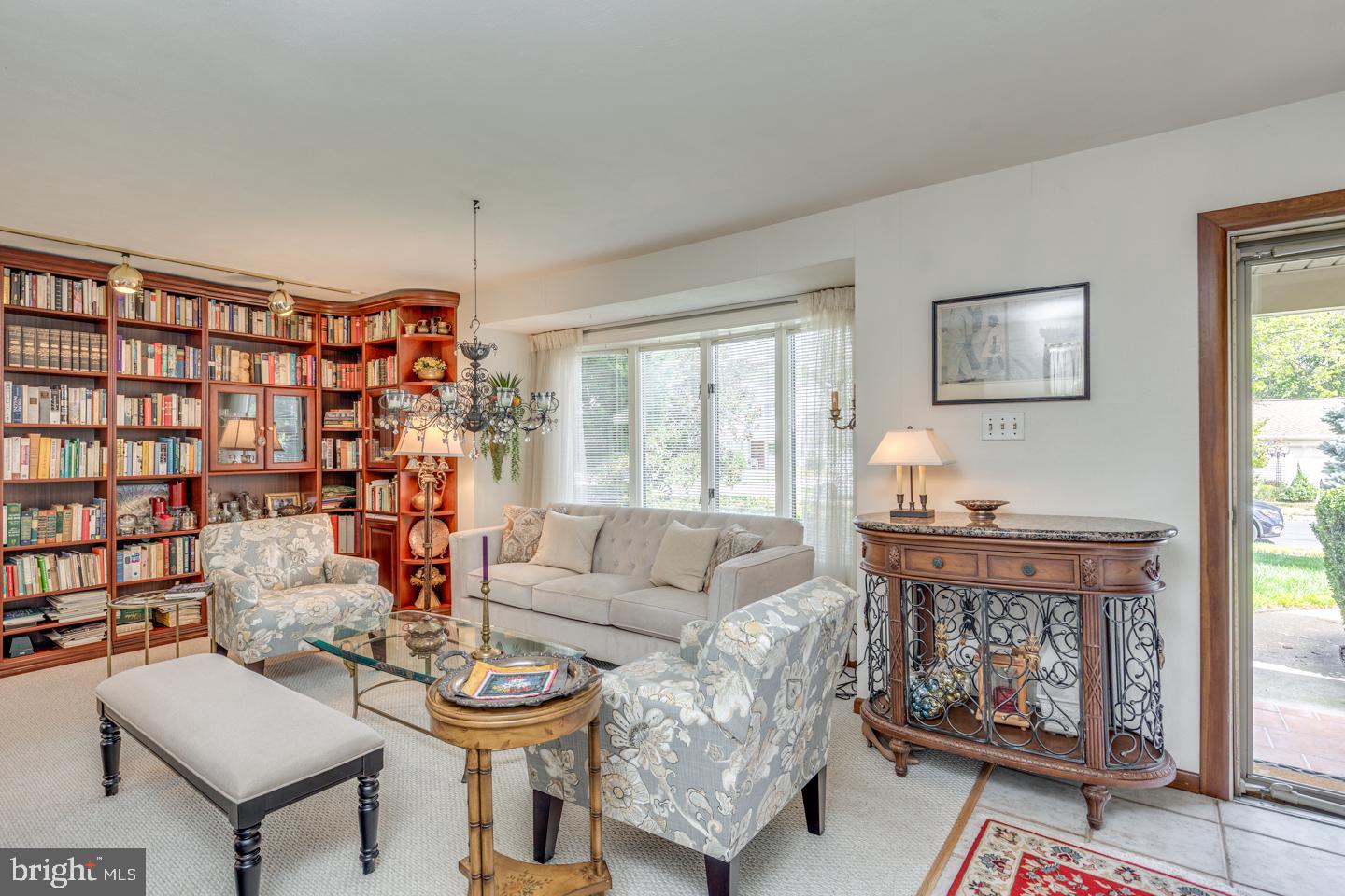 209 Harvest Road Cherry Hill, NJ 08002 - Photo 9 of 46 a living room with furniture a rug and a large window