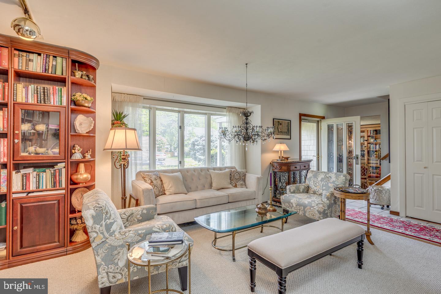 209 Harvest Road Cherry Hill, NJ 08002 - Photo 10 of 46 a living room with furniture a bookshelf and a large window