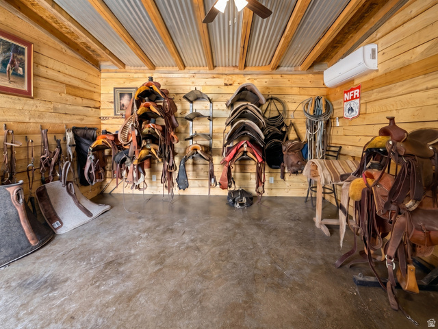 115 East 1600th Street North Santaquin, UT 84655 - Photo 46 of 52 Storage room with natural wood-paneled walls, a corrugated metal ceiling, and concrete flooring