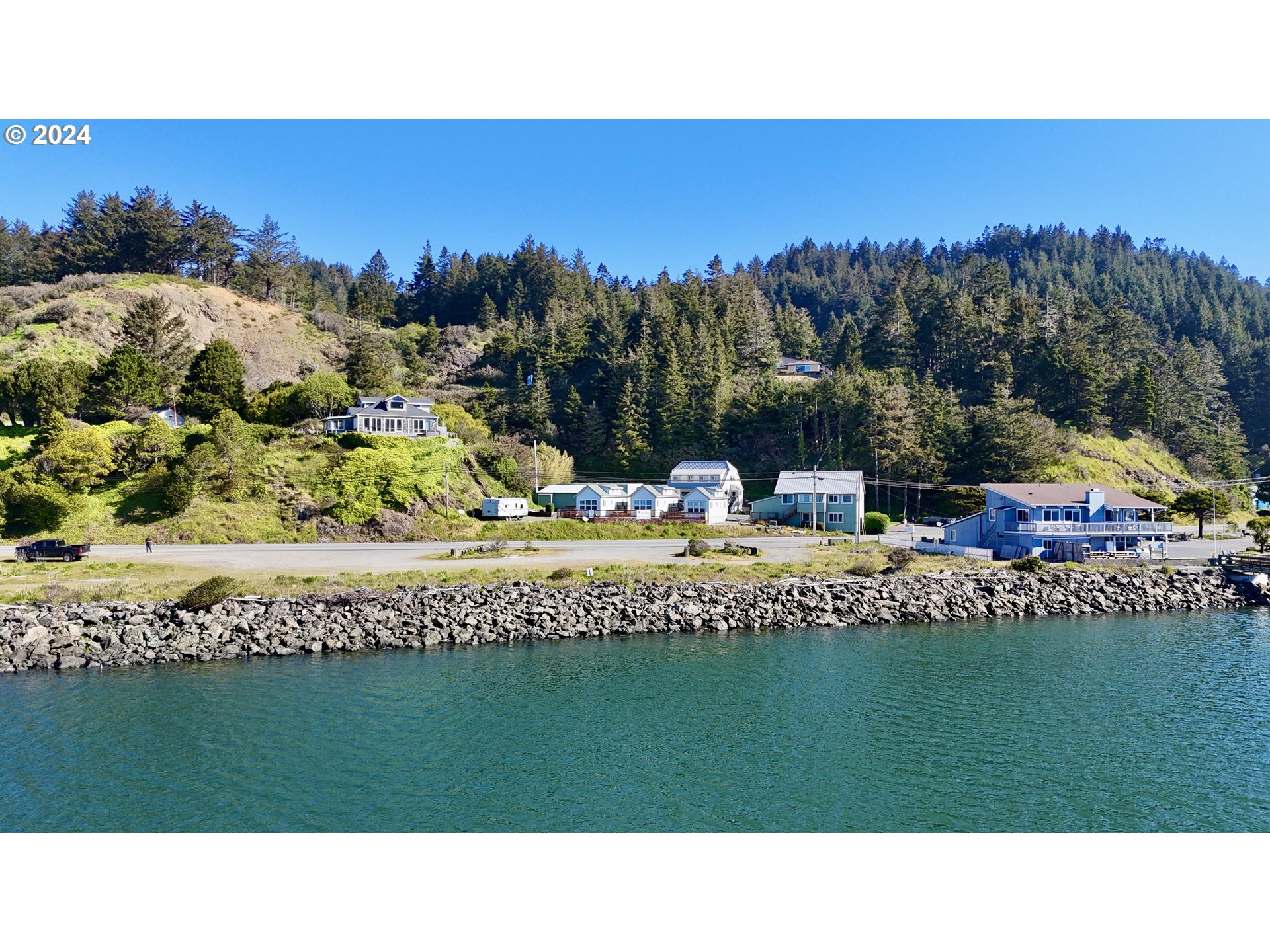 Wedderburn Loop Gold Beach, OR 97444 - Photo 17 of 24 a view of a swimming pool and a yard