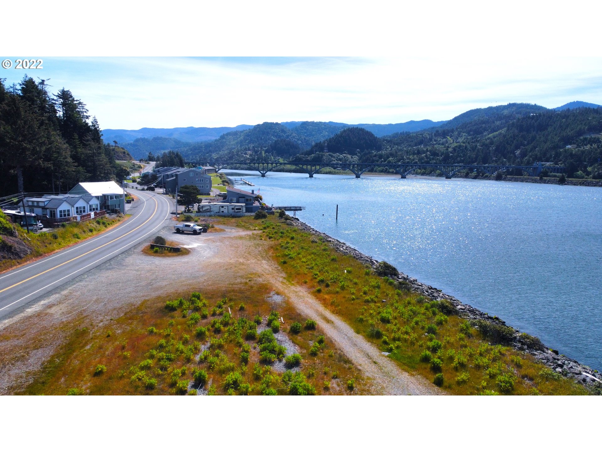 Wedderburn Loop Gold Beach, OR 97444 - Photo 3 of 24 a view of a backyard with a garden and mountain view