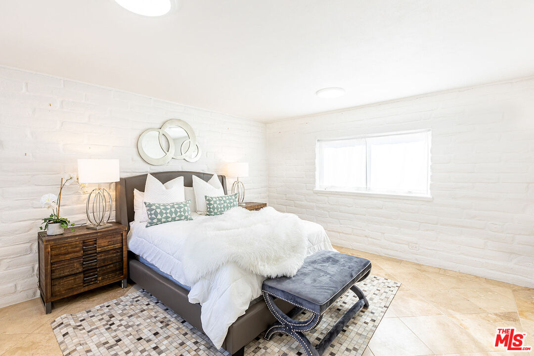 876 Center Street El Segundo, CA 90245 - Photo 13 of 32 a bedroom with a bed and dresser