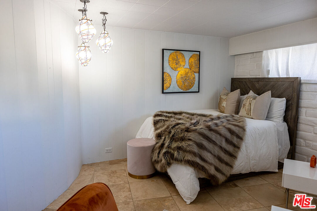 876 Center Street El Segundo, CA 90245 - Photo 24 of 32 a bedroom with a bed and painting on the wall