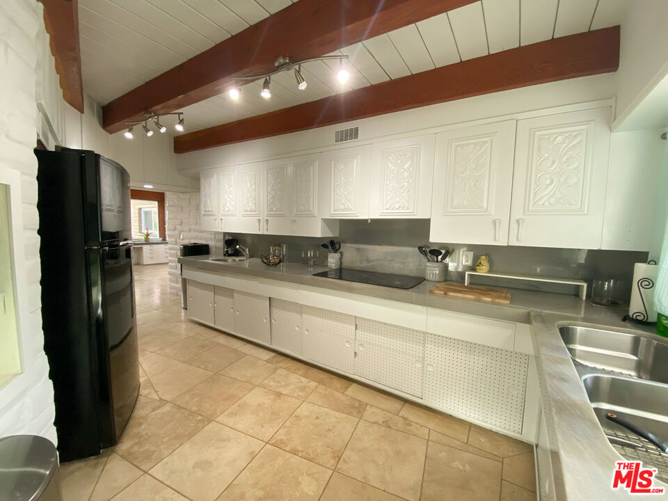 876 Center Street El Segundo, CA 90245 - Photo 26 of 32 a large kitchen with stainless steel appliances granite countertop a refrigerator and a sink
