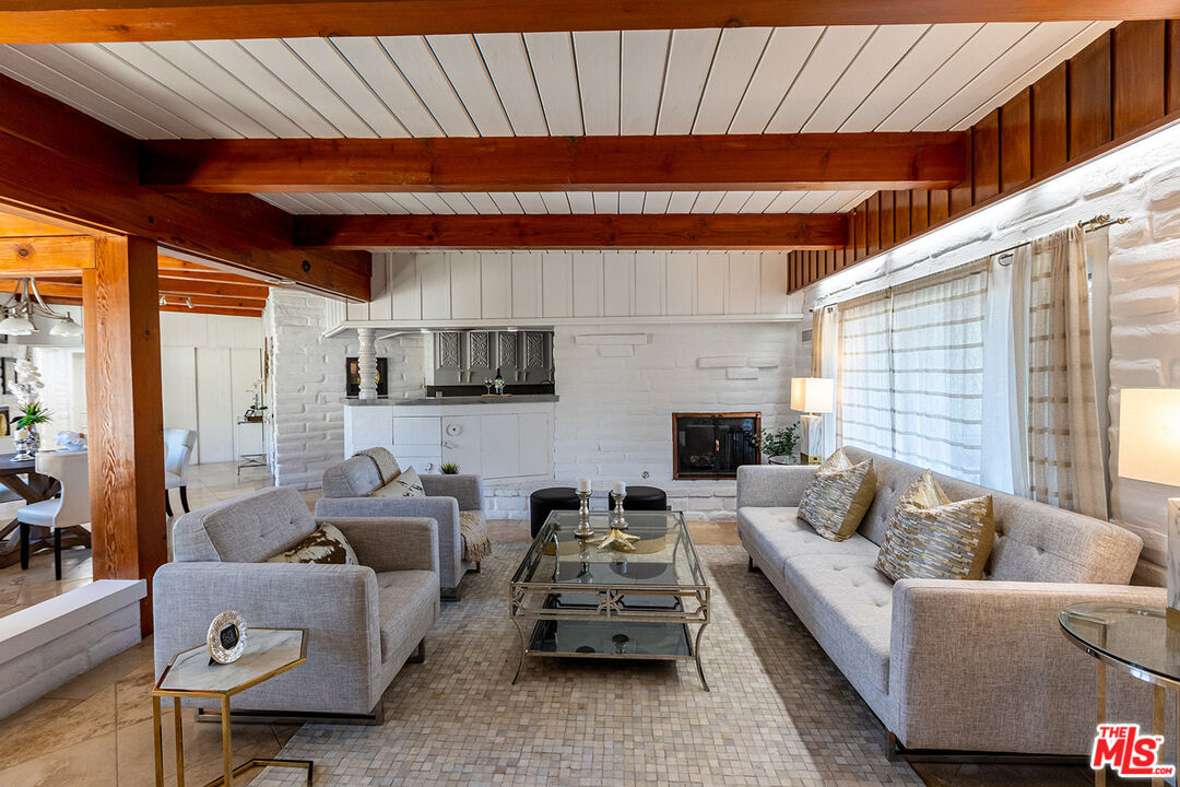 876 Center Street El Segundo, CA 90245 - Photo 7 of 32 a living room with furniture a fireplace and a table