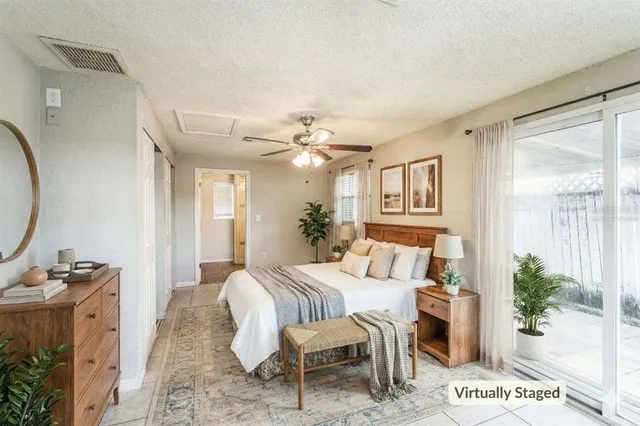a bedroom with furniture and a mirror