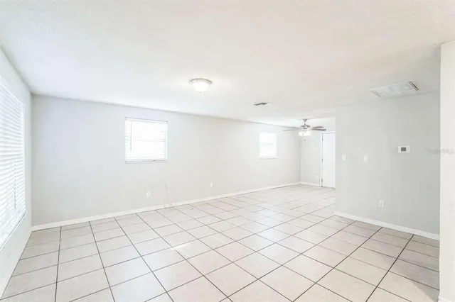 a view of an empty room and window