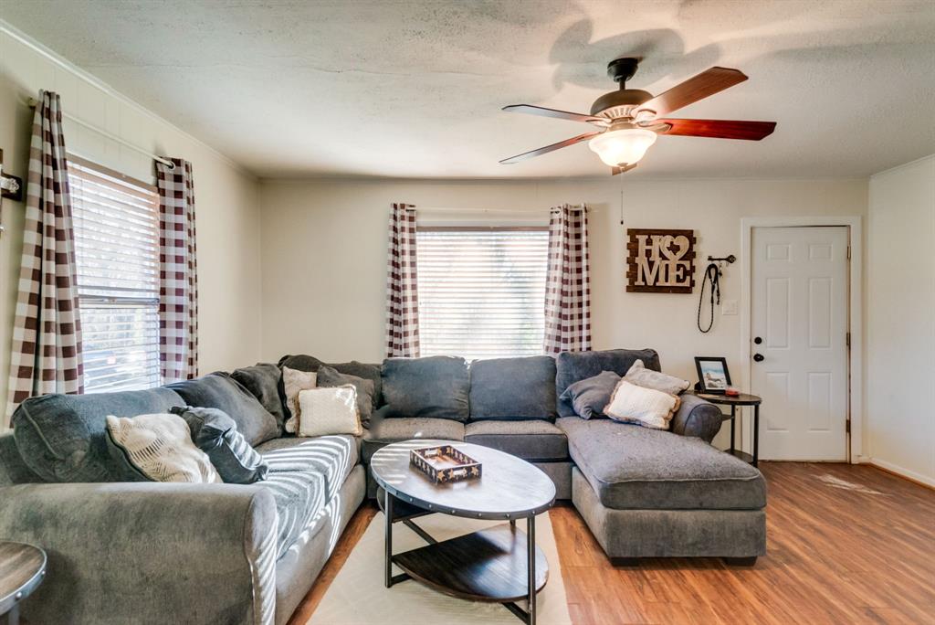 211 Clinton Drive Weatherford, TX 76086 - Photo 1 of 1 a living room with furniture and a large window
