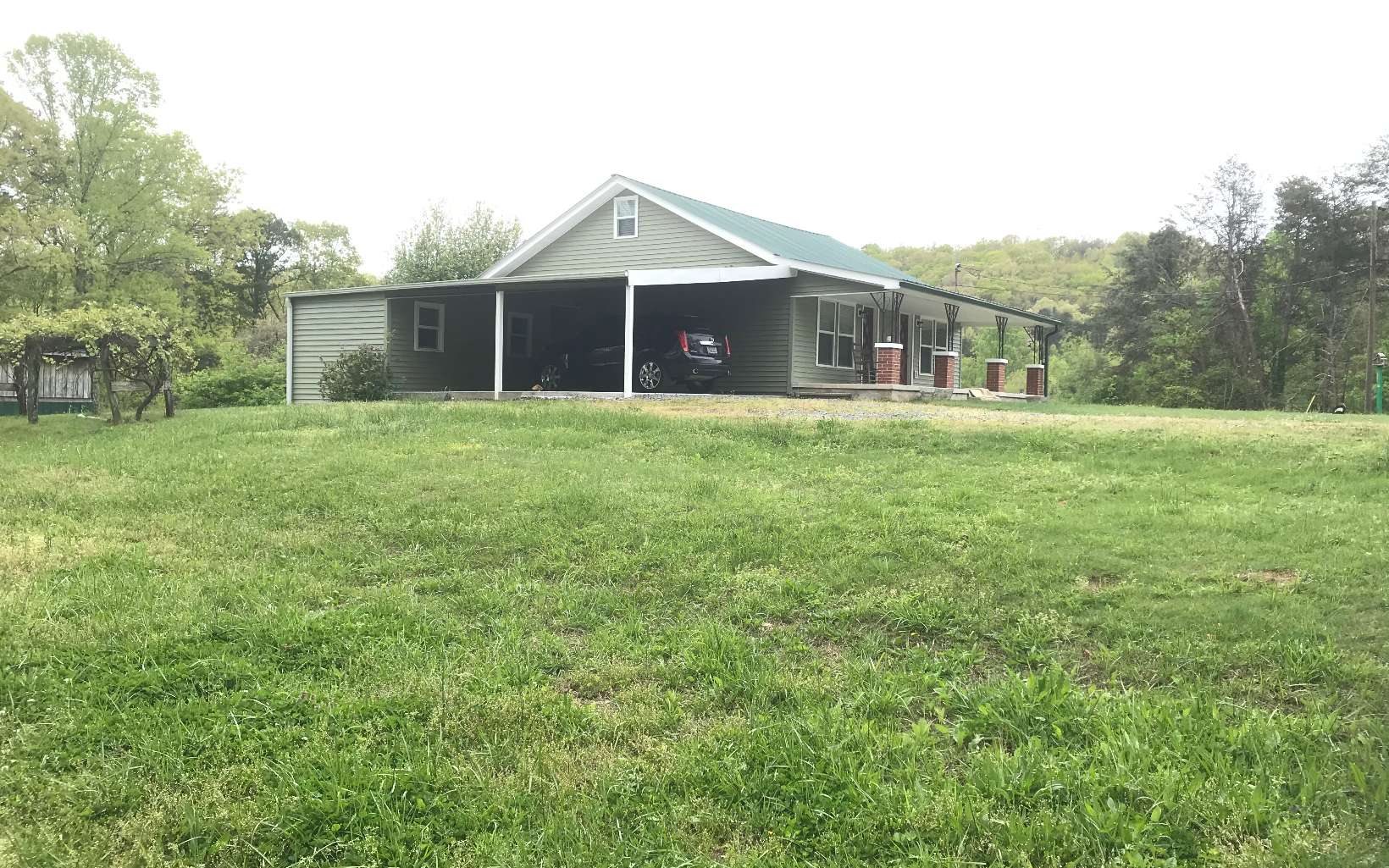 21 Dills Road Blue Ridge, GA 30513 - Photo 1 of 1 a front view of a house with a garden
