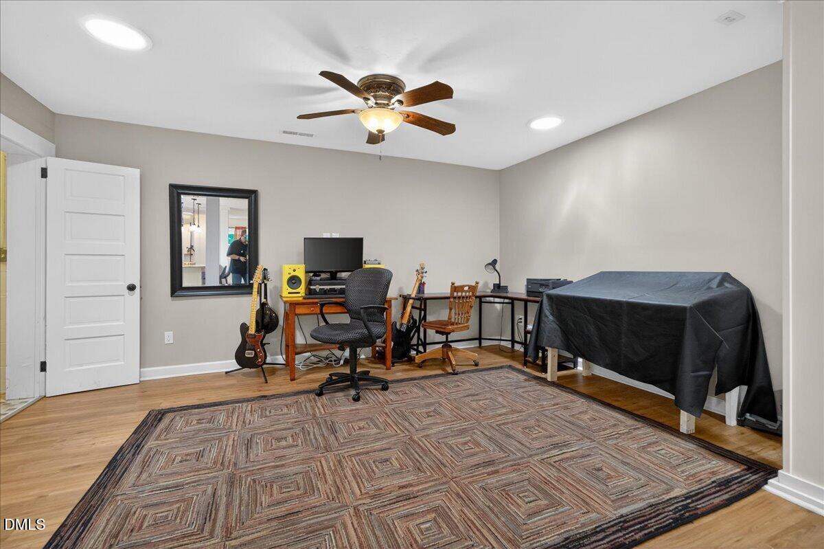 7303 Stony Hill Road Wake Forest, NC 27587 - Photo 11 of 31 a view of a workspace with furniture and a window