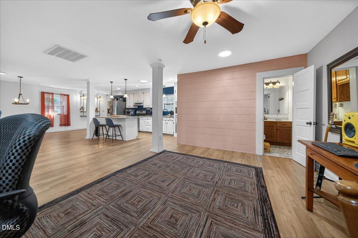 7303 Stony Hill Road Wake Forest, NC 27587 - Photo 12 of 31 a living room with furniture and a wooden floor