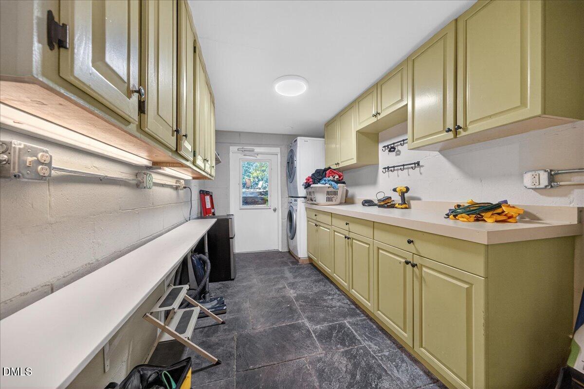 7303 Stony Hill Road Wake Forest, NC 27587 - Photo 19 of 31 a kitchen with a sink a refrigerator and cabinets