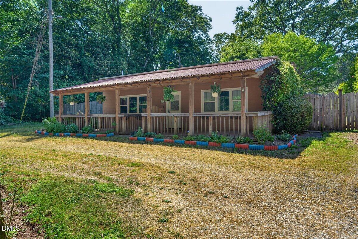7303 Stony Hill Road Wake Forest, NC 27587 - Photo 2 of 31 a view of a house with backyard and garden