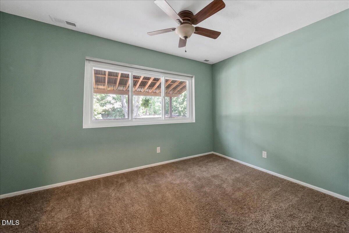 7303 Stony Hill Road Wake Forest, NC 27587 - Photo 25 of 31 a view of room with window and ceiling fan