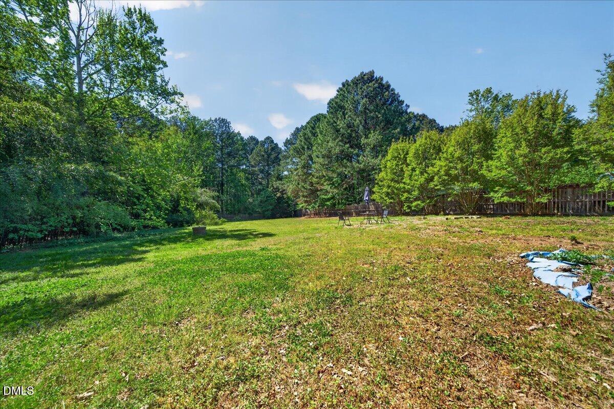 7303 Stony Hill Road Wake Forest, NC 27587 - Photo 29 of 31 a view of outdoor space with deck and yard
