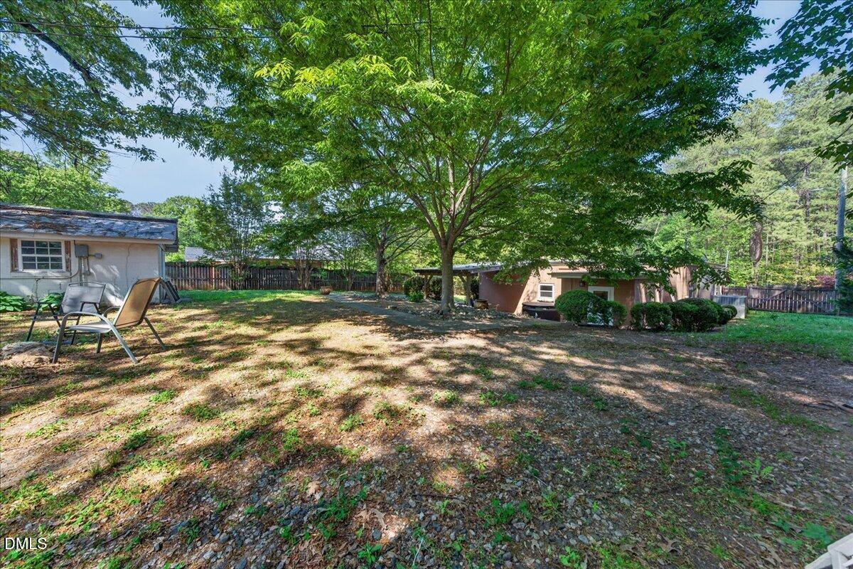 7303 Stony Hill Road Wake Forest, NC 27587 - Photo 31 of 31 a view of a house with backyard and a tree