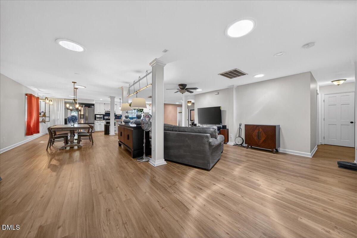 7303 Stony Hill Road Wake Forest, NC 27587 - Photo 7 of 31 a living room with stainless steel appliances furniture and a wooden floor