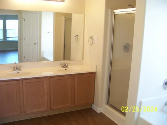 a view of an empty room with closet and a window