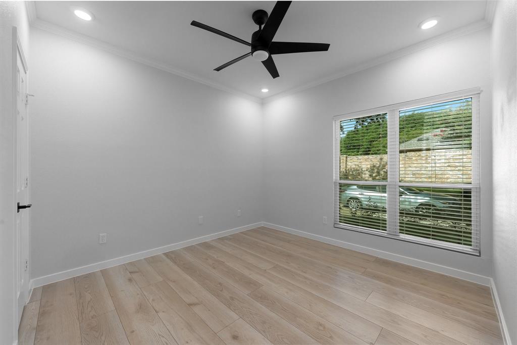14140 Regency Place Dallas, TX 75254 - Photo 28 of 38 Light wood-finish flooring complements the neutral wall tones