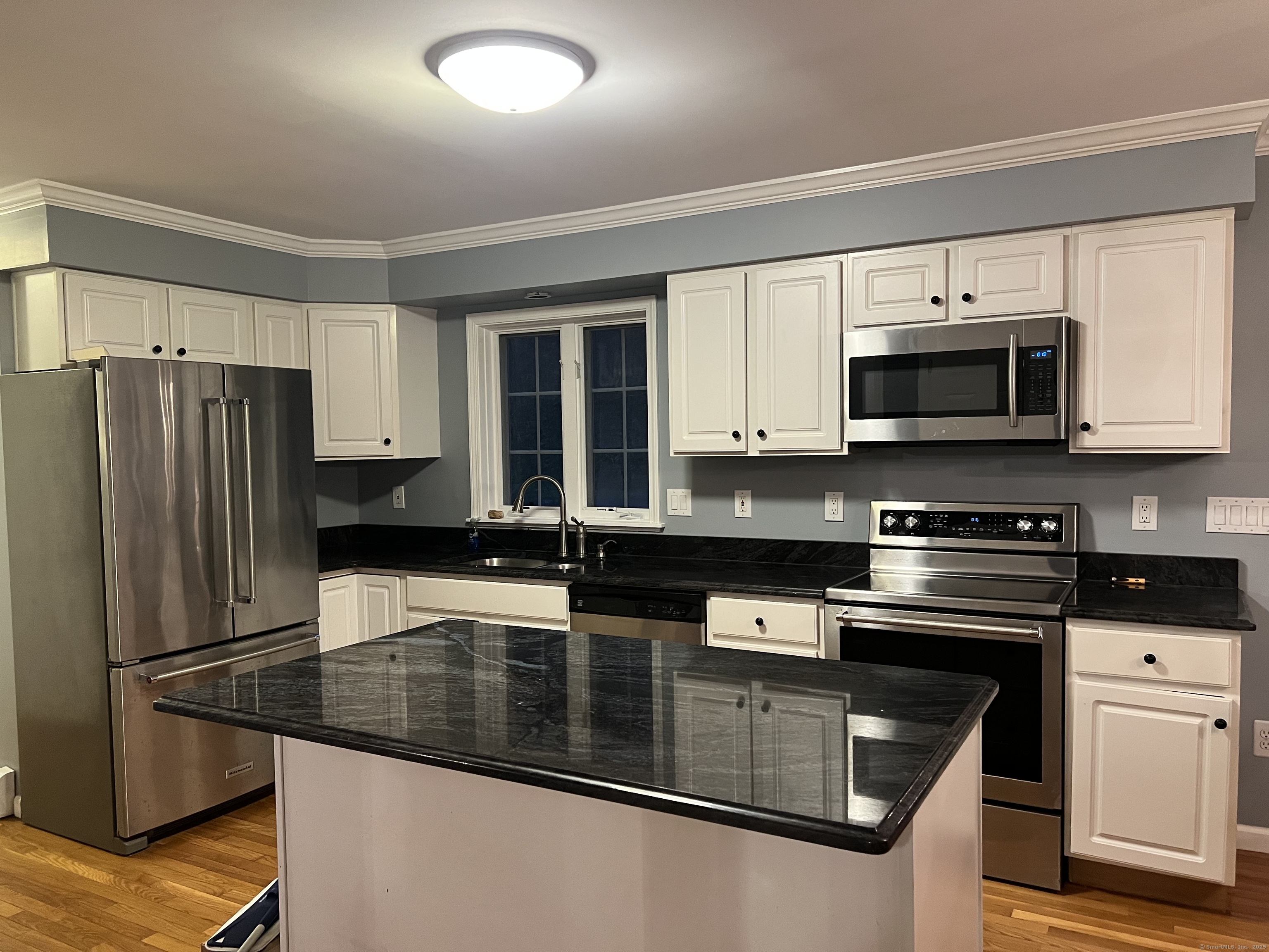 44 North Mountain Road Brookfield, CT 06804 - Photo 4 of 18 a kitchen with stainless steel appliances granite countertop a stove a sink and a microwave