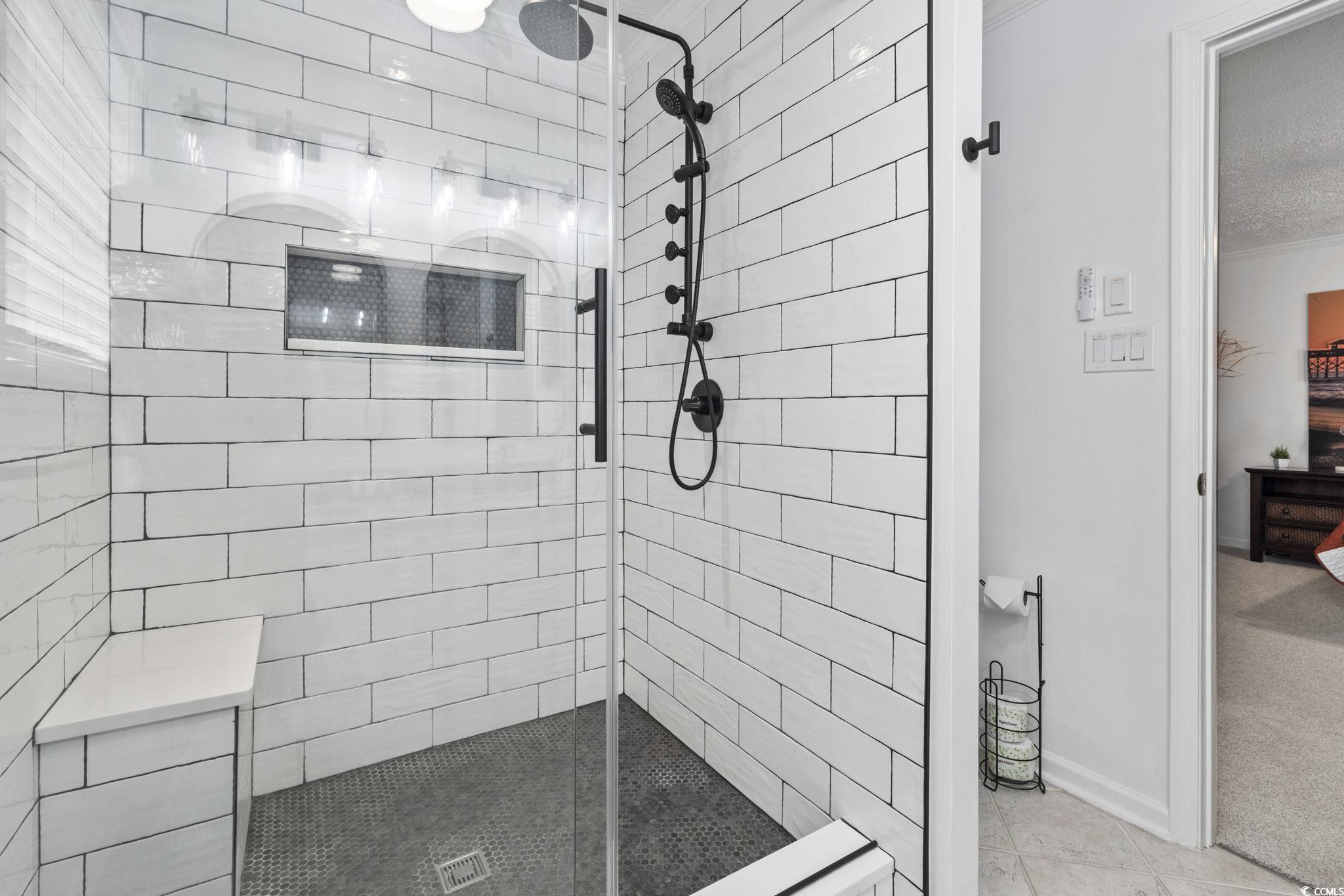 327 A Lakeside Drive Surfside Beach, SC 29575 - Photo 18 of 40 Full bathroom with a tile shower, connected bathroom, ornamental molding, tile patterned flooring, and baseboards