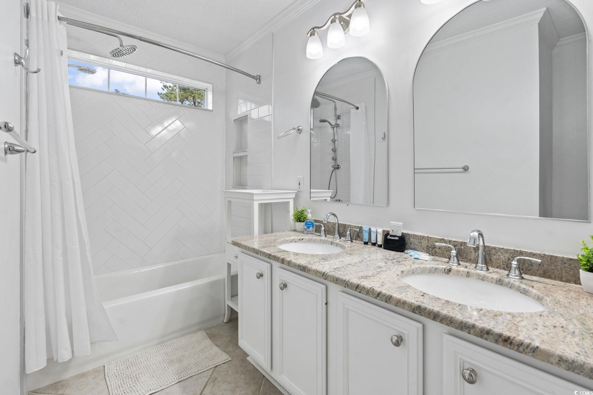 327 A Lakeside Drive Surfside Beach, SC 29575 - Photo 19 of 40 Bathroom featuring shower / bath combo, crown molding, double vanity, and tile patterned flooring