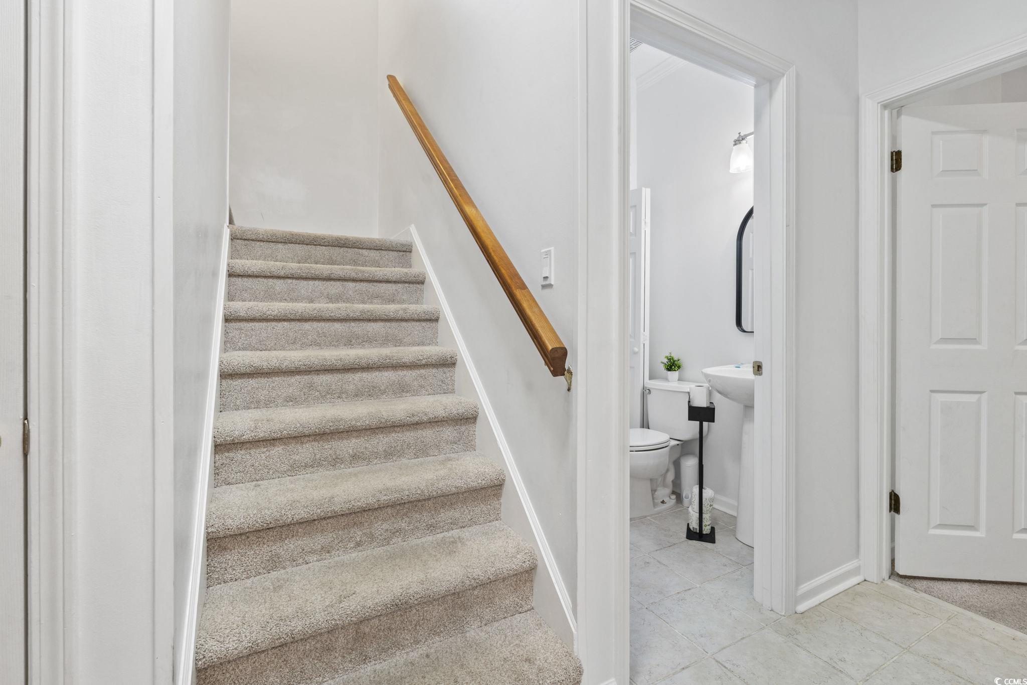 327 A Lakeside Drive Surfside Beach, SC 29575 - Photo 20 of 40 Staircase featuring tile patterned floors and baseboards