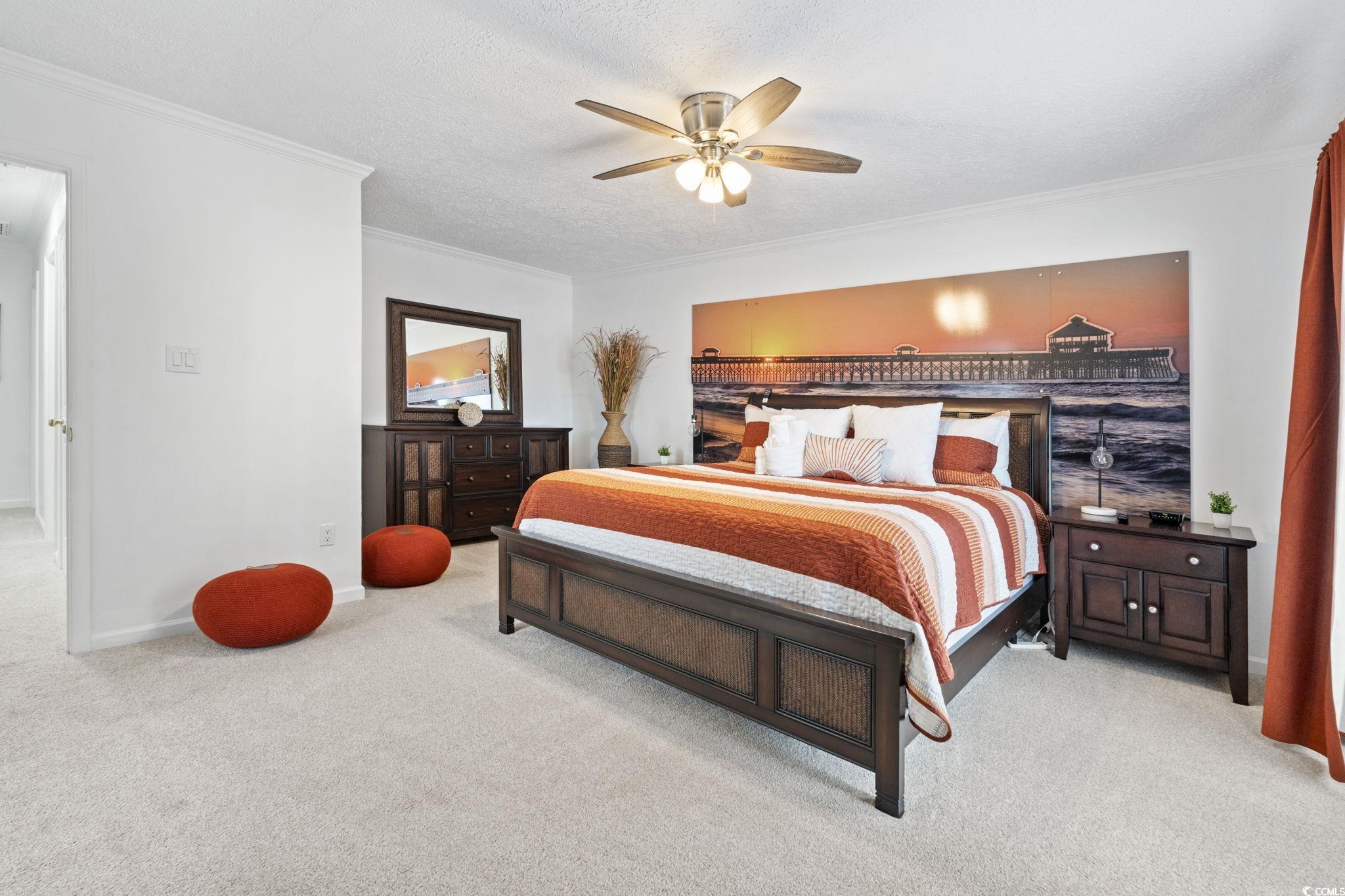 327 A Lakeside Drive Surfside Beach, SC 29575 - Photo 22 of 40 Carpeted bedroom featuring ornamental molding, ceiling fan, and baseboards