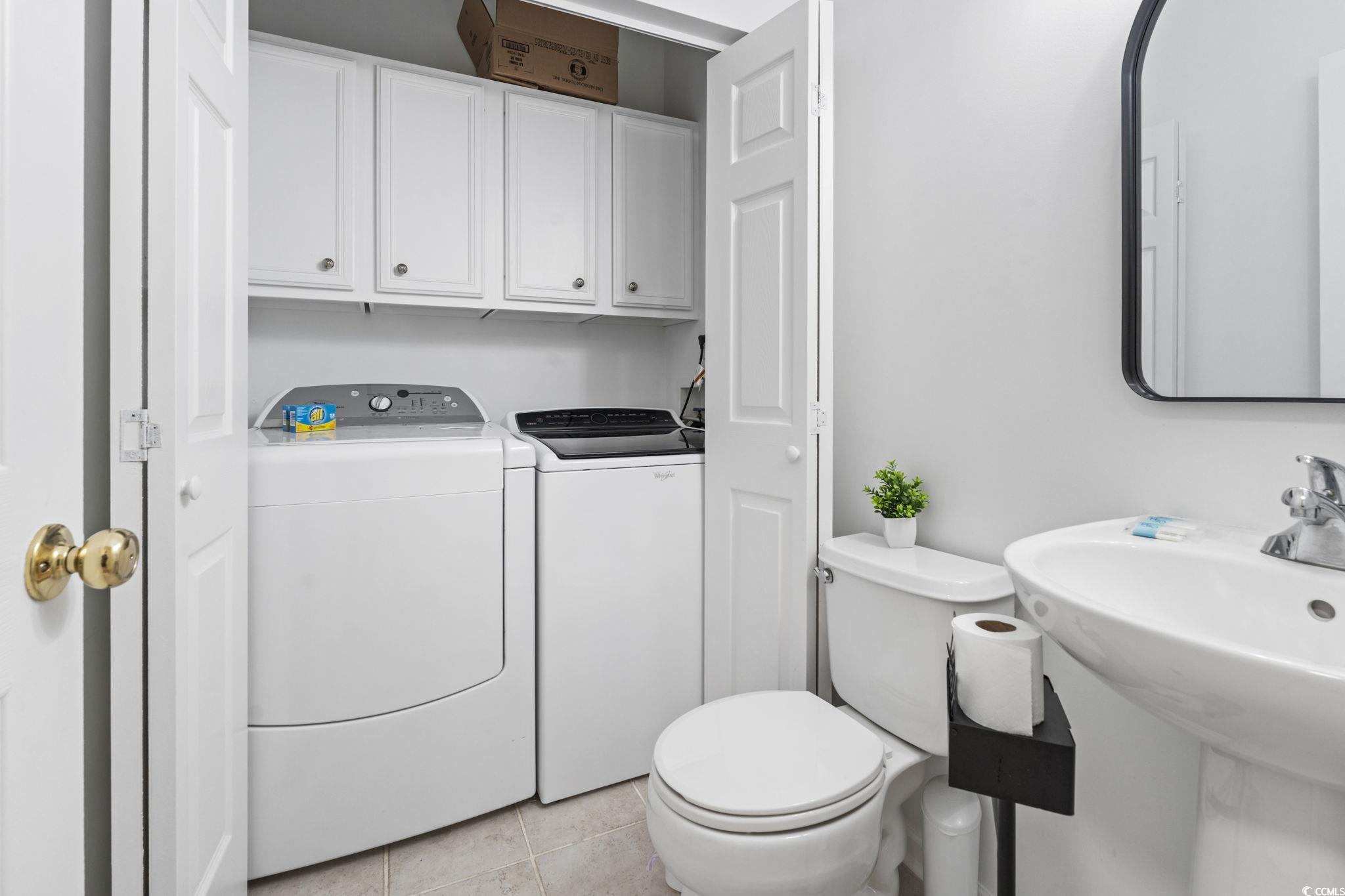 327 A Lakeside Drive Surfside Beach, SC 29575 - Photo 28 of 40 Bathroom with washing machine and clothes dryer, toilet, and tile patterned flooring