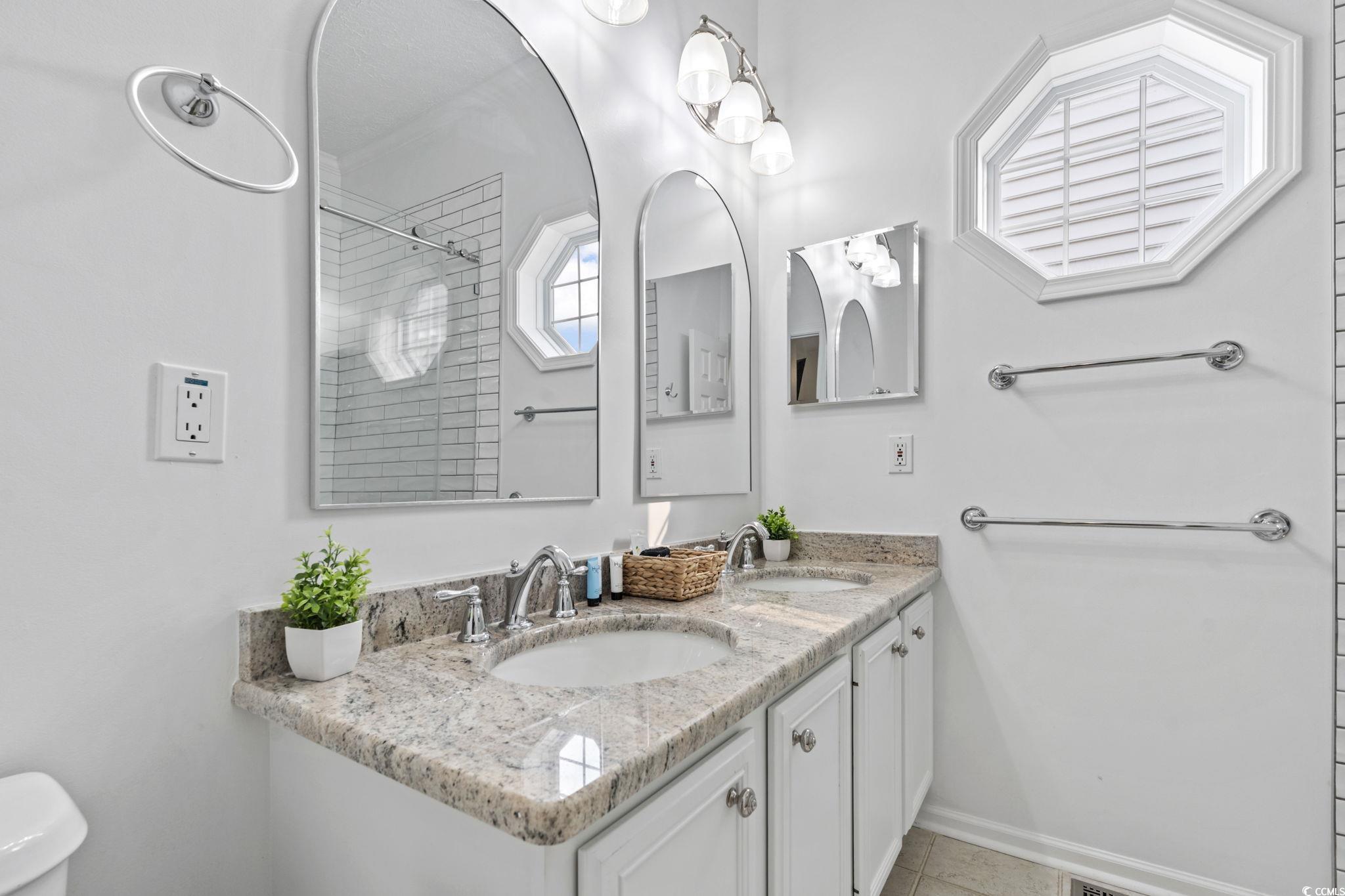 327 A Lakeside Drive Surfside Beach, SC 29575 - Photo 29 of 40 Bathroom featuring toilet, a shower, tile patterned floors, baseboards, and double vanity