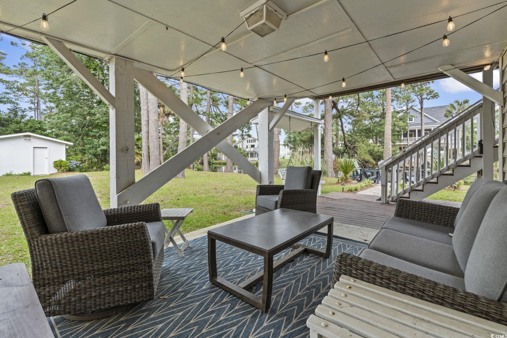 327 A Lakeside Drive Surfside Beach, SC 29575 - Photo 4 of 40 Wooden deck with stairs and a yard