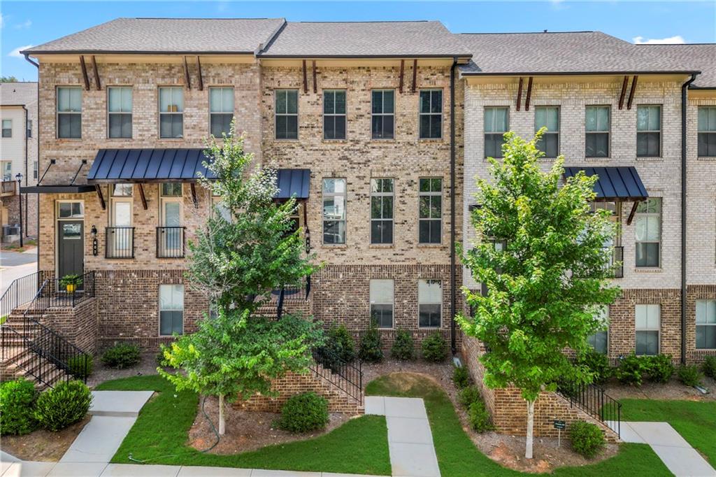 a front view of a building with garden