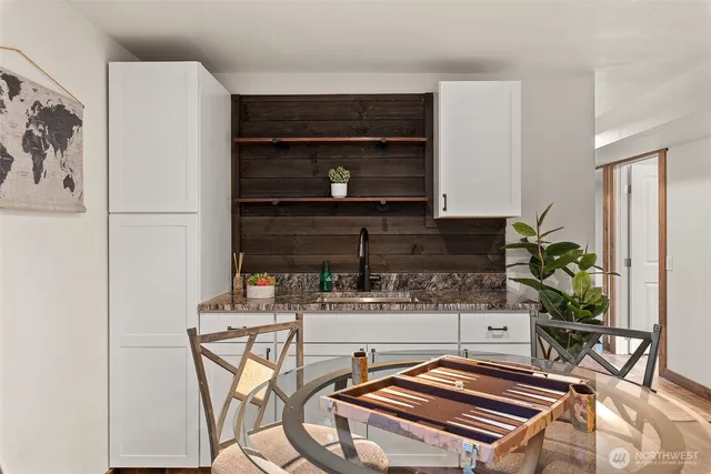 a living room with a couch and a potted plant
