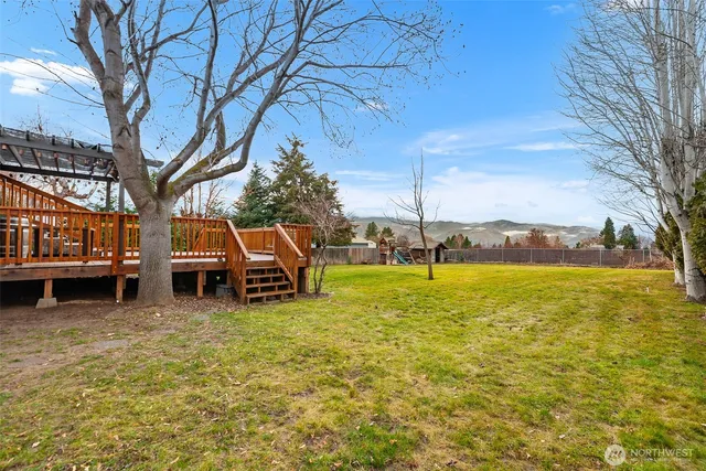 a view of a lake with a car parked in the background