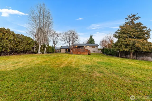 a view of a swimming pool with an outdoor space and seating area