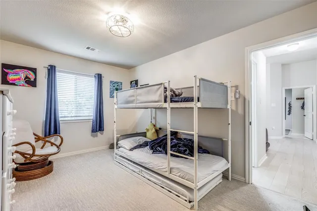 a bathroom with a tub sink double vanity and tub
