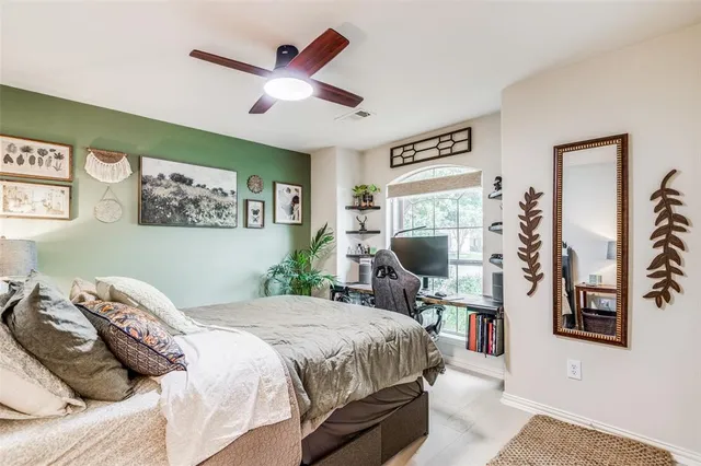 a bedroom with a bed and a desk