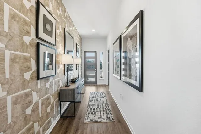 a bedroom with a bed and a chandelier fan