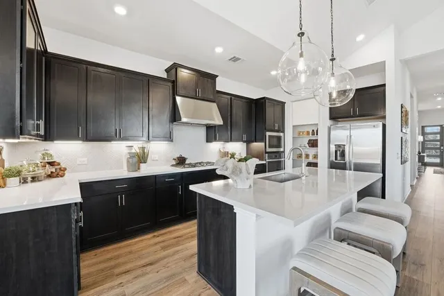 a spacious bedroom with a bed and a large window