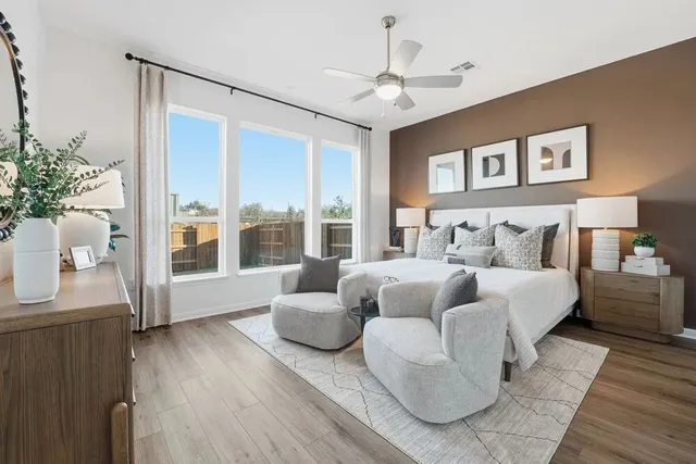 a kitchen with stainless steel appliances granite countertop a sink a stove and a wooden floors