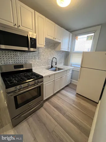 a kitchen with a stove and a sink