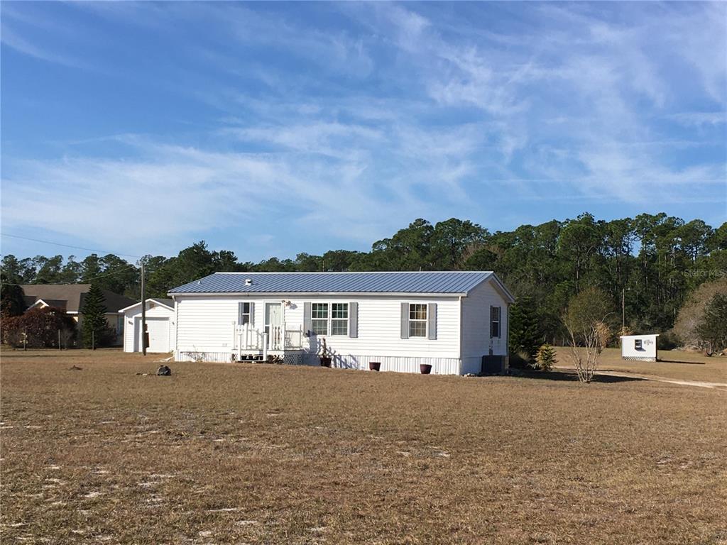 1297 Pfundstein Road Babson Park, FL 33827 - Photo 3 of 65 a view of house with outdoor space and sitting area