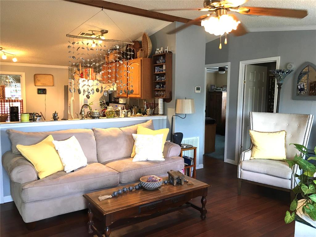 1297 Pfundstein Road Babson Park, FL 33827 - Photo 7 of 65 a living room with furniture a chandelier and a dining table