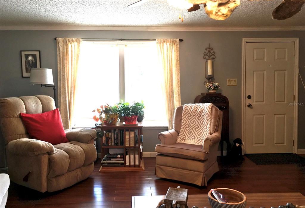 1297 Pfundstein Road Babson Park, FL 33827 - Photo 8 of 65 a living room with furniture rug and wooden floor