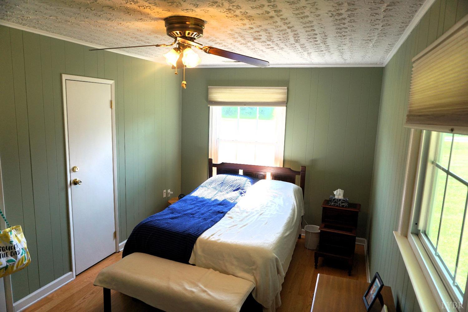 26 Pilot View Road Concord, VA 24538 - Photo 15 of 26 a bedroom with a bed and a chandelier