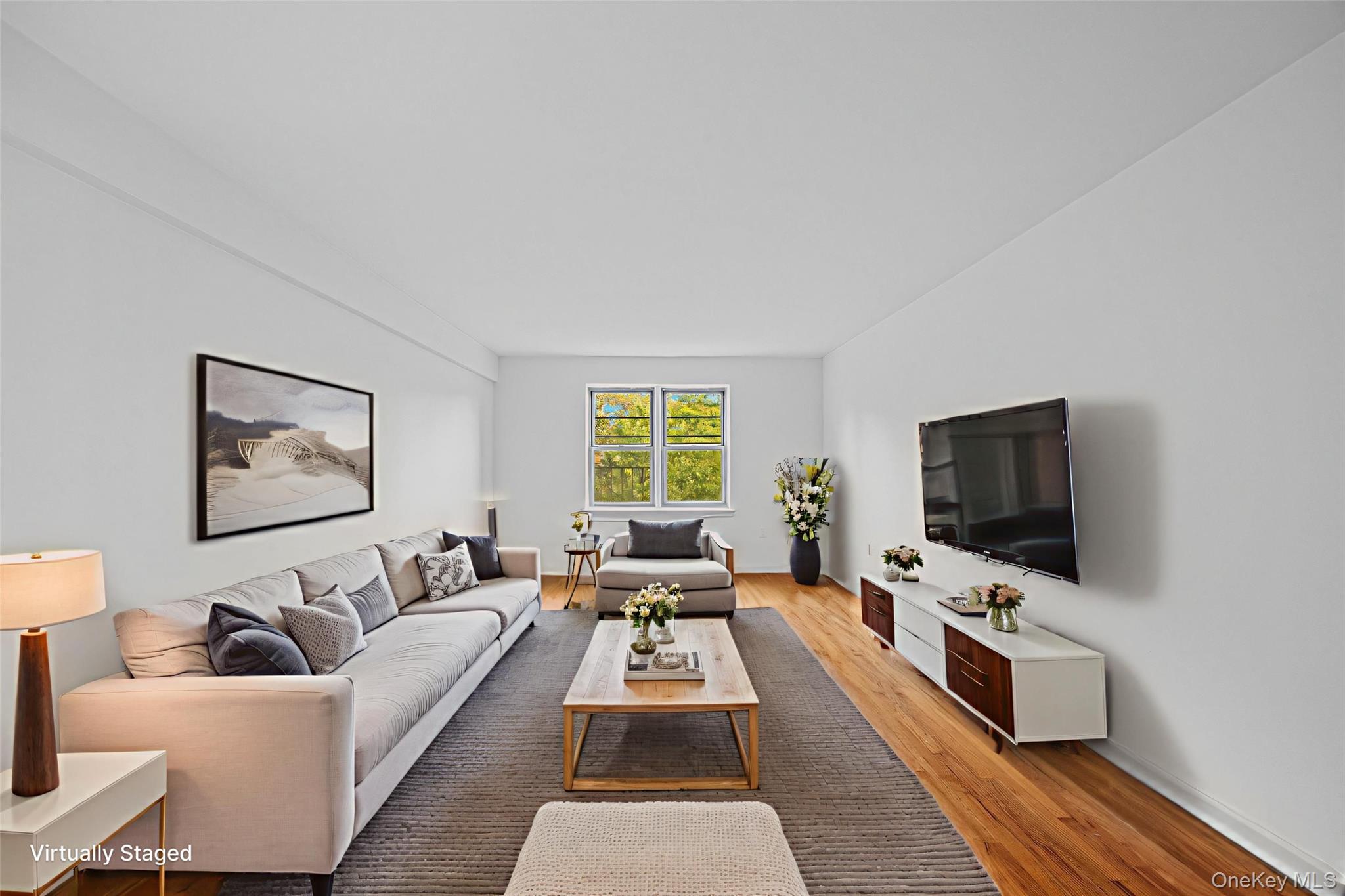 a living room with furniture and a flat screen tv